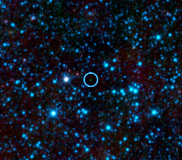 Зеленая точка в центре изображение – коричневый карлик WISE 1828+2650. Фото NASA/JPL-Caltech/UCLA 