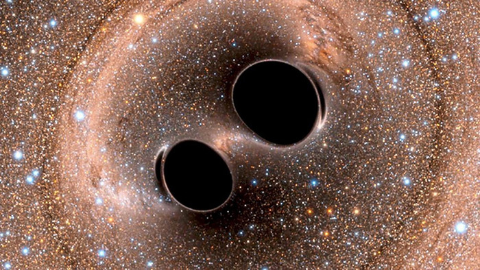 Две сближающиеся черные дыры.