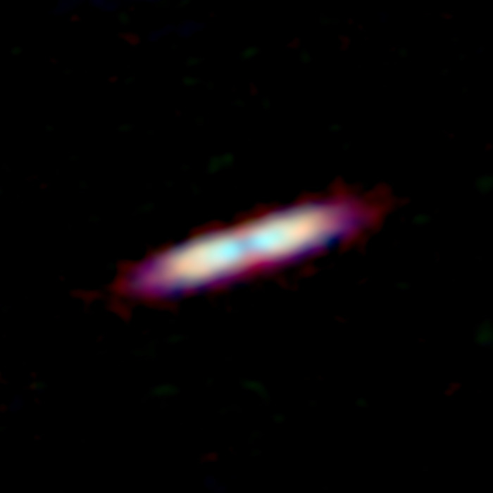 Составное изображение ALMA обломков вокруг молодой звезды.