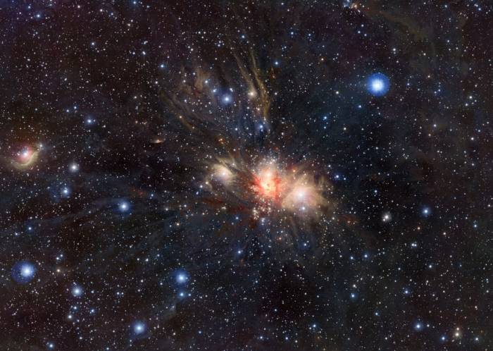 Область звездообразования R2 в созвездии Единорога. Фото ESO/J. Emerson/VISTA. Acknowledgment: Cambridge Astronomical Survey Unit