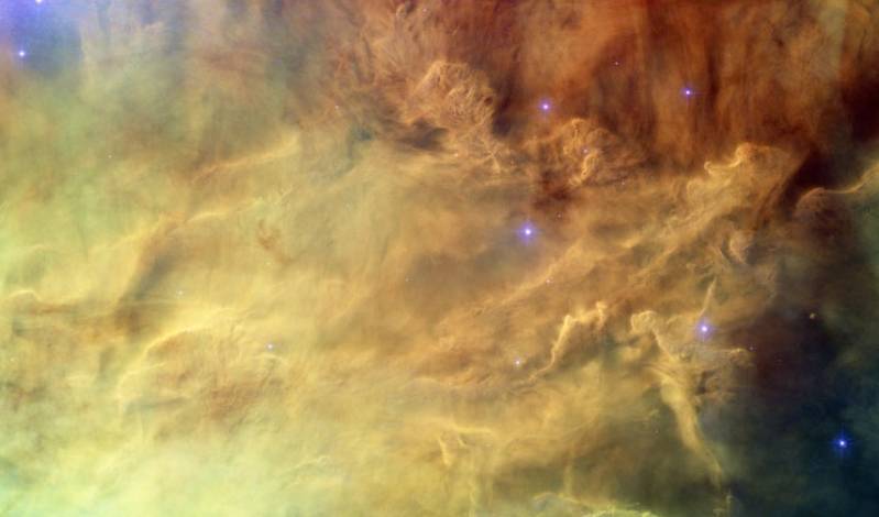 Волны светящегося газа и пыли в самом сердце туманности Лагуна. Фото NASA, ESA